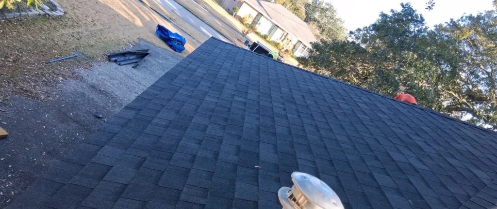 Completed residential roof replacement with Owens Corning Onyx Black architectural shingles and roof vent, Slidell LA