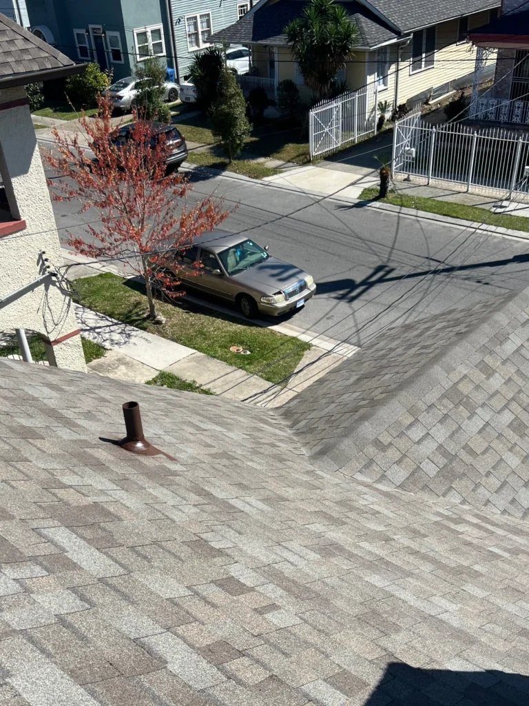 Completed large residential roof replacement with Owens Corning Driftwood architectural shingles and pipe boot vent, Kenner LA