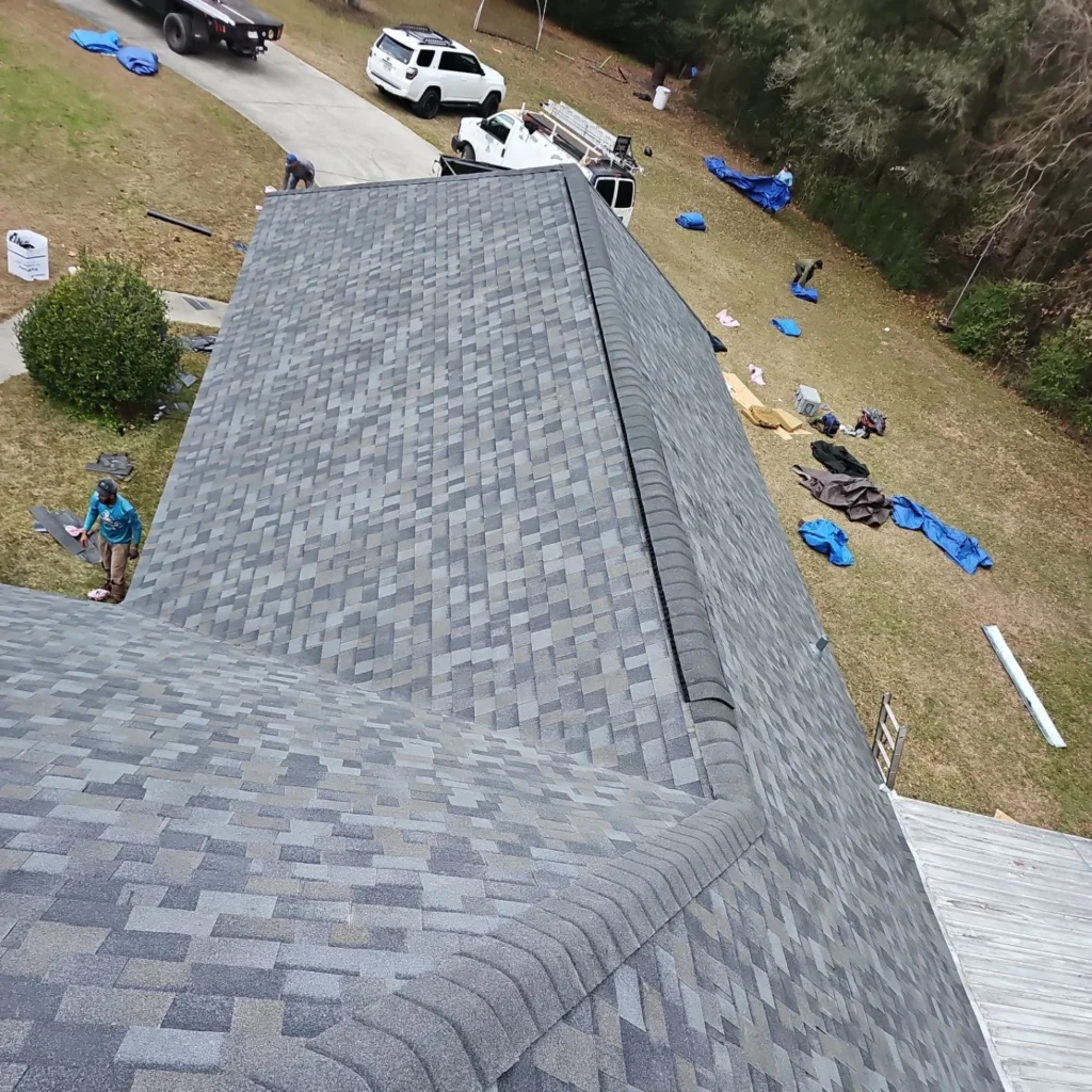 Aerial view of completed large residential roof replacement with Owens Corning Williamsburg Gray architectural shingles, Covington LA.
